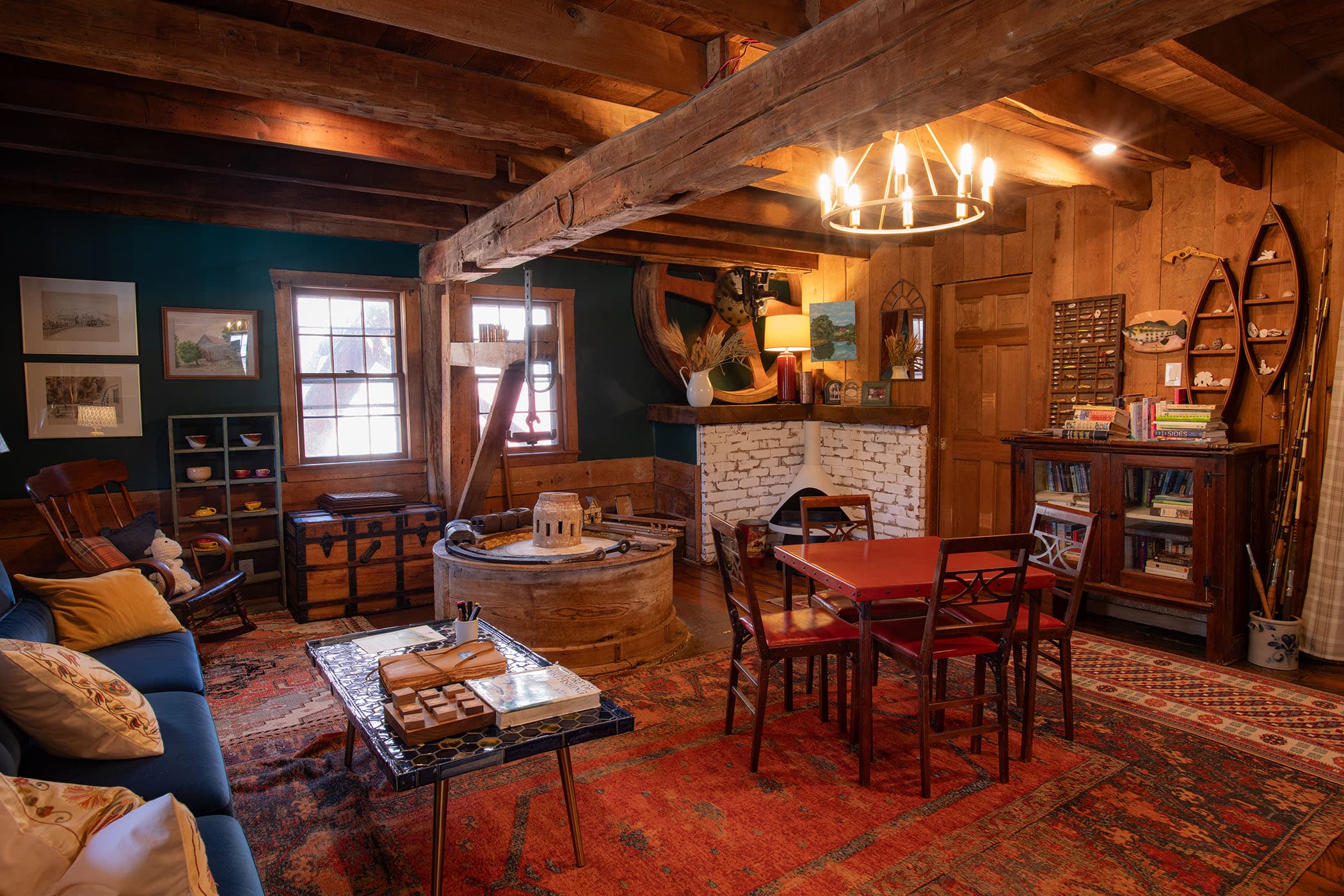 Parlor and old grinding wheel operated by water wheel of mill house