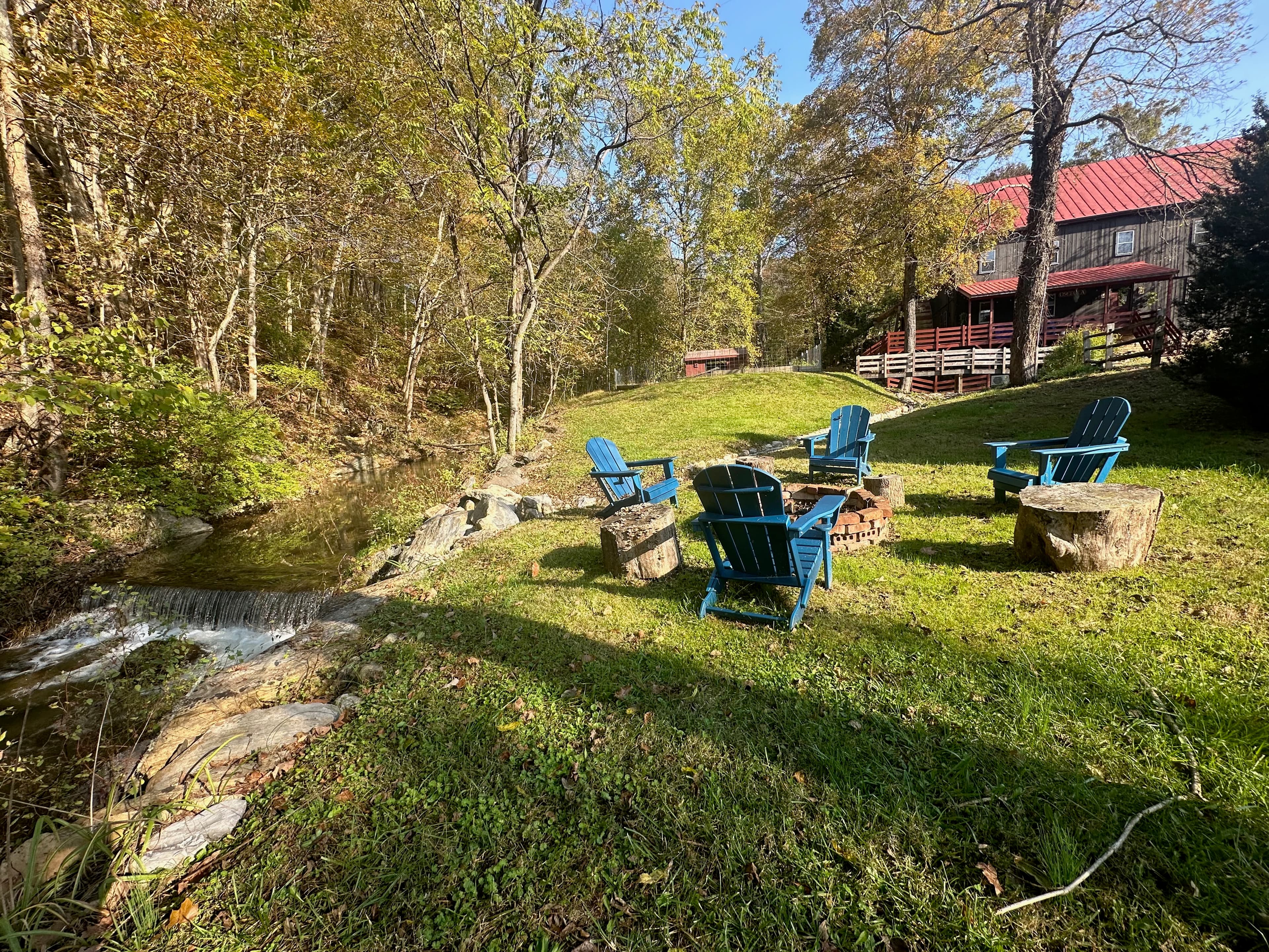 Fire pit next to Marl Creek outside of cabin